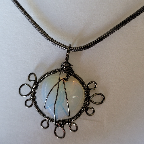 Opal Colored Stone Encased in Twisted Gunmetal Necklace